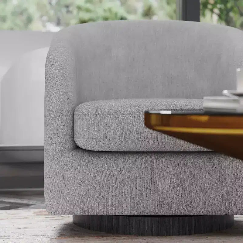 Fauteuil club capitonné avec pivotement à 360 degrés et accoudoirs inclinés